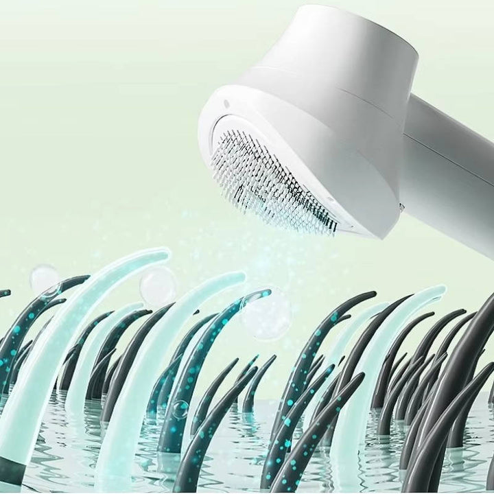Cat enjoying a gentle grooming session with a low-noise pet hair dryer and massage comb.