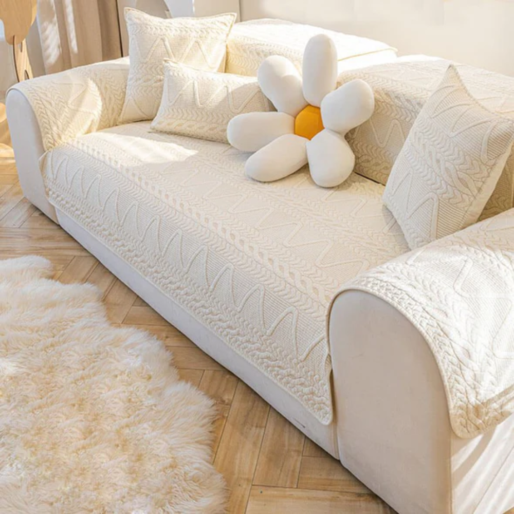 Quilted anti-slip sectional sofa cover in grey, offering pet-friendly furniture protection in a living room