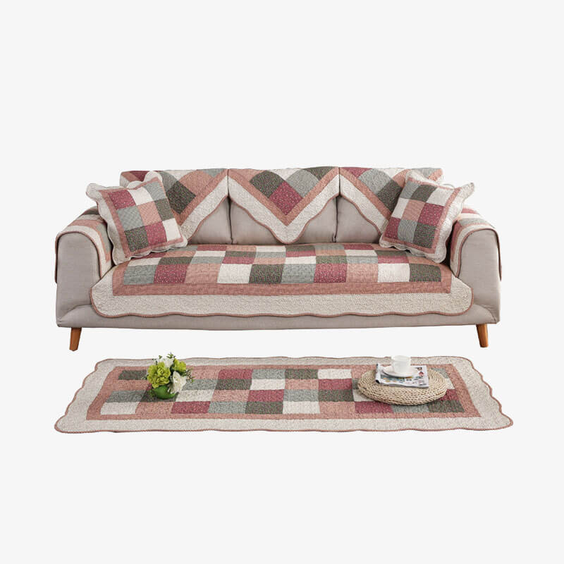 Modern quilted non-slip sofa cover, cotton blend fabric, washable, enhancing home decor.