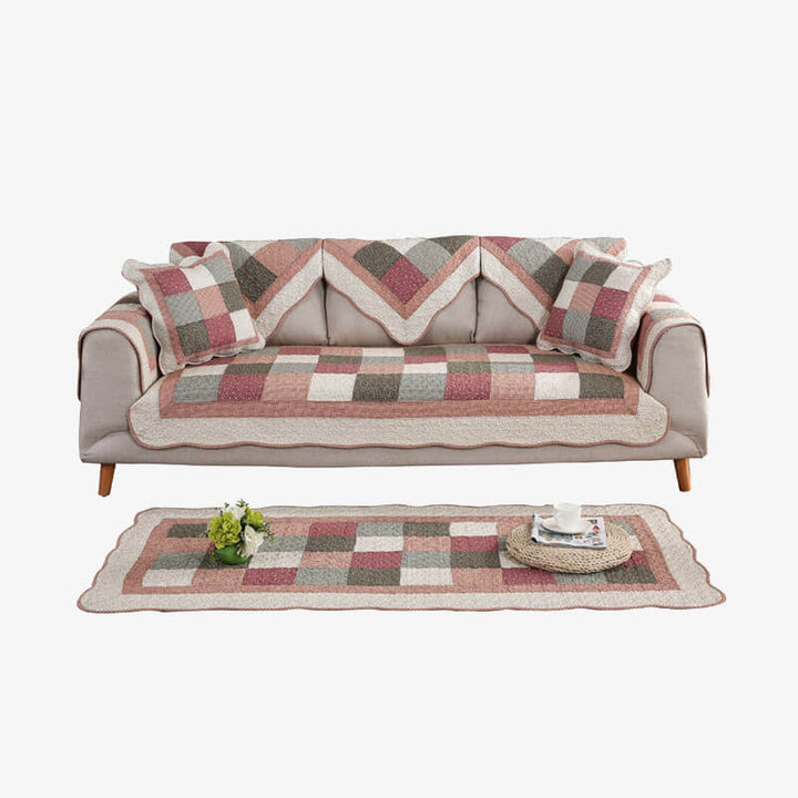 Modern quilted non-slip sofa cover, cotton blend fabric, washable, enhancing home decor.
