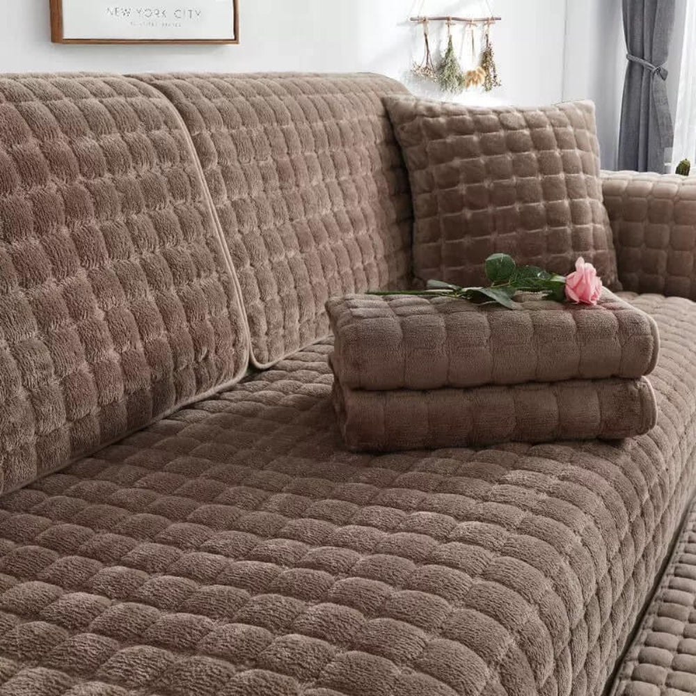 Close-up of quilted flannel sofa cover texture, anti-slip backing, durable home decor.