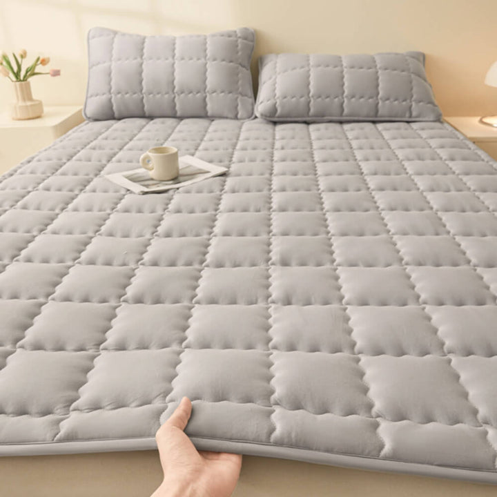 Layered view of mattress topper: quilted, breathable, and non-slip for bed comfort