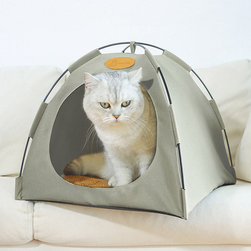 Modern rattan cat tent with a plush interior and a cooling mat for hot weather.