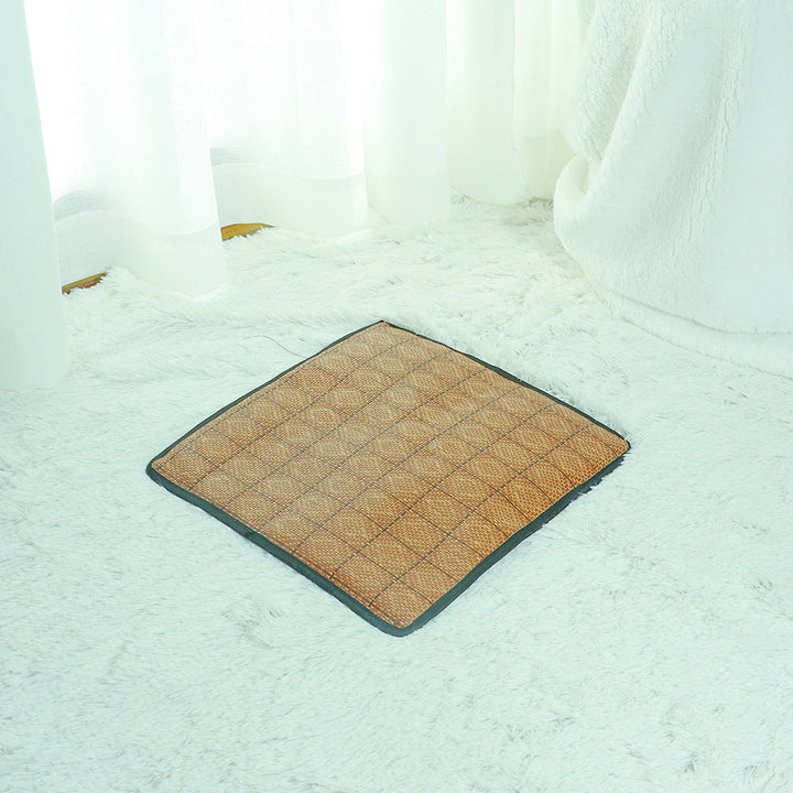 Compact rattan cat bed with a washable cooling mat, simple setup for pet owners.