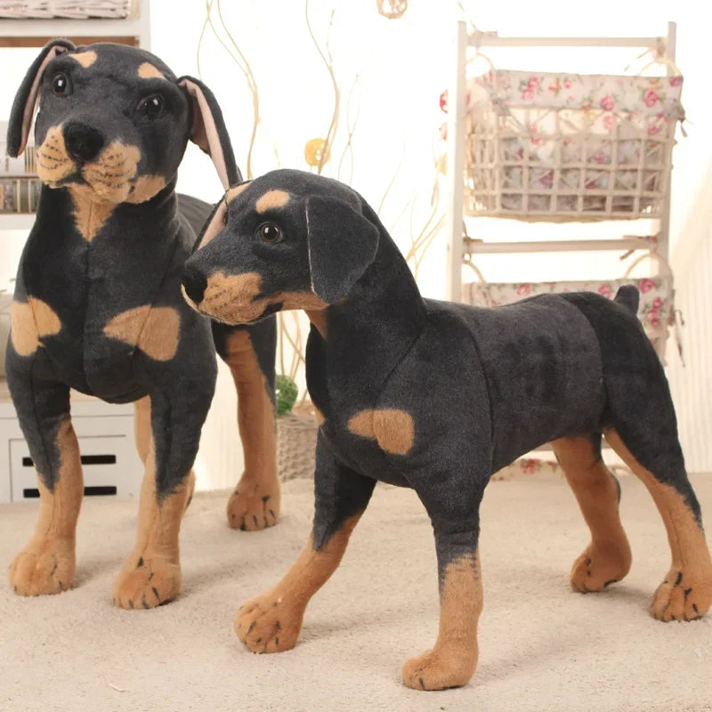 Realistic black dog plush toy, a soft cuddly stuffed animal for kids and pet lovers.