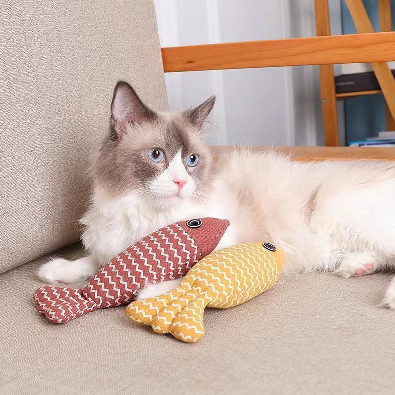 Interactive fish cat toy filled with catnip, designed for pet enrichment & entertainment.