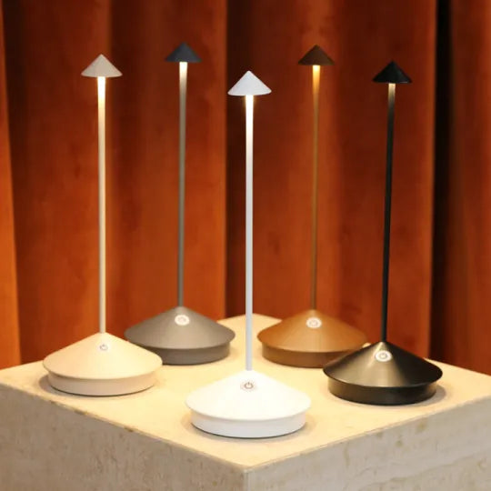 Sleek LED table lamp, cordless & rechargeable, brings modern light to home decor.