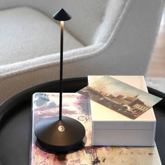 Ambient light table lamp, rechargeable LED, sleek & cordless for modern home decor.
