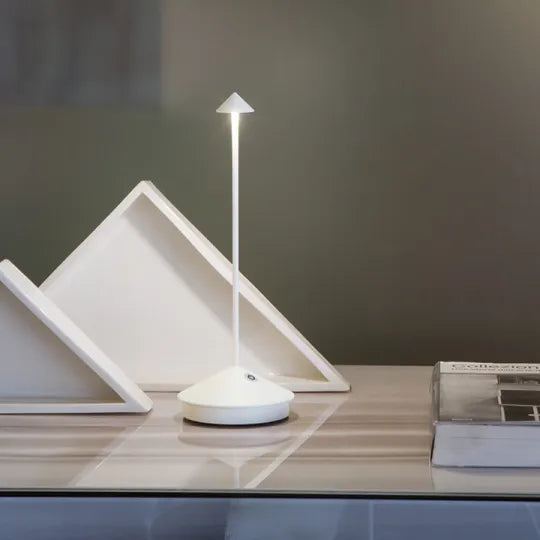 Portable cordless LED lamp for elegant indoor and outdoor mood lighting.