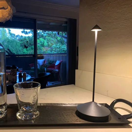 Rechargeable table lamp, LED & cordless, offers perfect ambient light for any space.