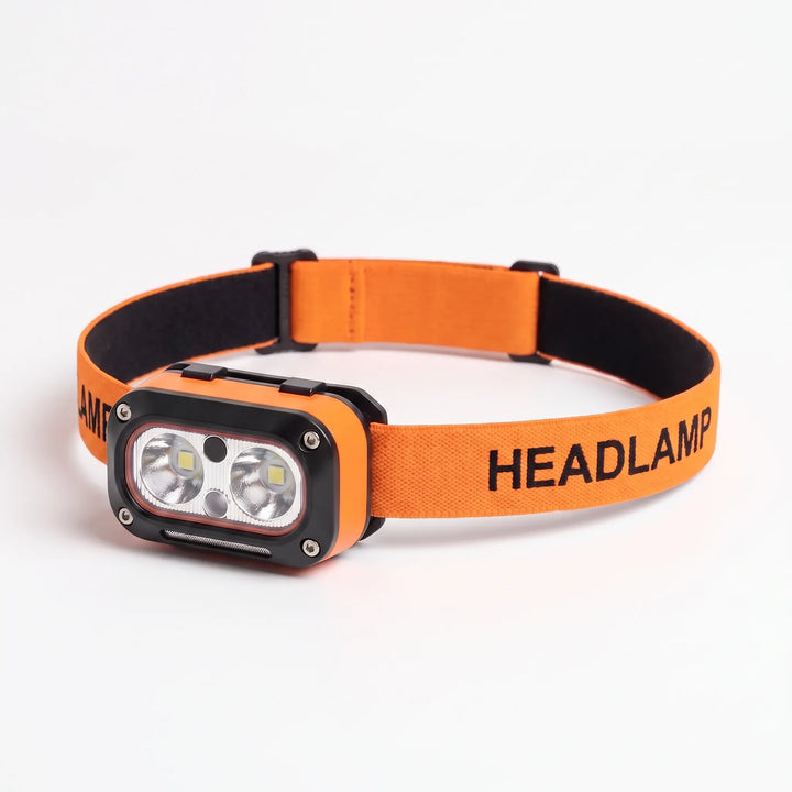 USB rechargeable headlamp, ideal for work, fishing, or emergency lighting. Portable and bright LED illumination.