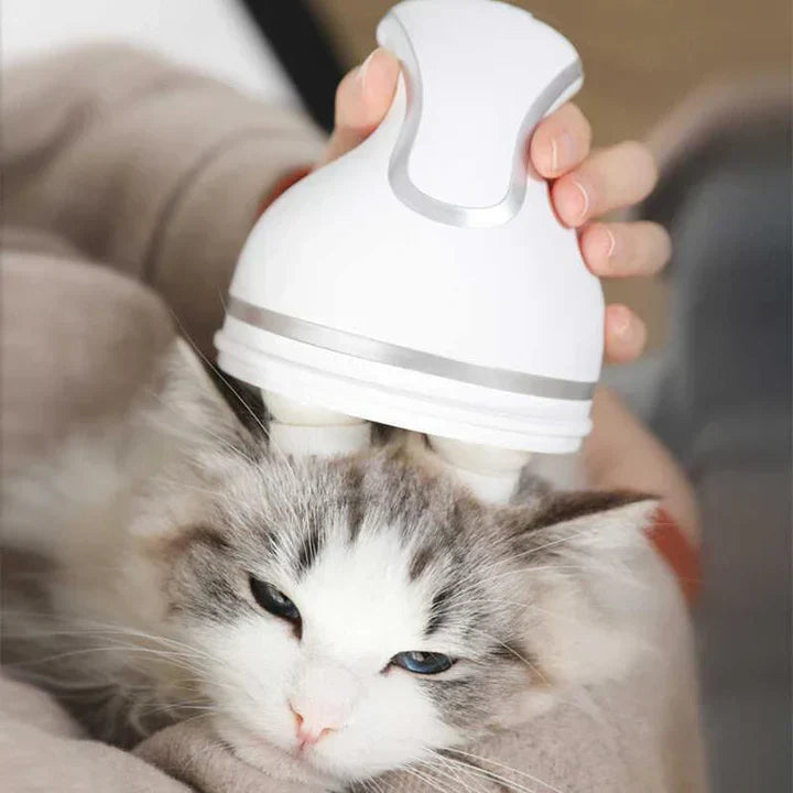Hand holding pet electric head massager, showcasing its ergonomic design for dog & cat relaxation