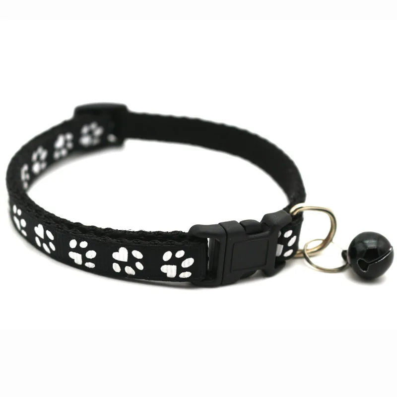 Red adjustable pet bowtie collar with bell and quick release buckle for small dogs, stylish pet accessory.