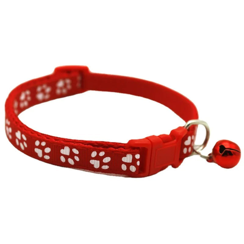 Blue adjustable dog collar with cute bowtie and bell, comfortable and safe quick release design.