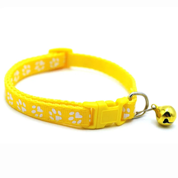 Yellow adjustable quick release pet collar with a charming bowtie and bell, comfortable dog accessory.