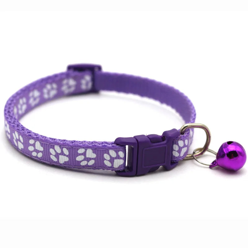 Black adjustable pet bowtie collar with a silver bell, sleek quick release design for small dogs.