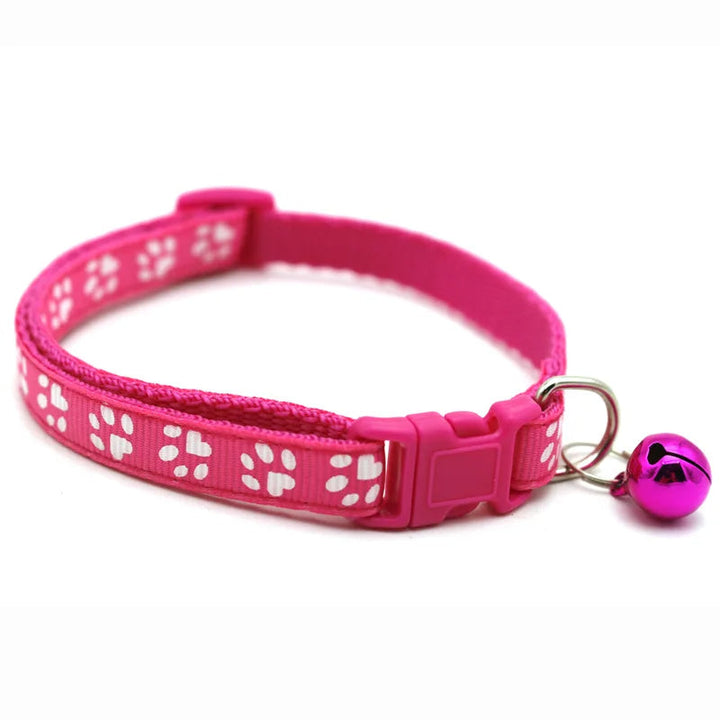 Pink cute pet collar with adjustable bowtie and bell, quick release for small, stylish pets.