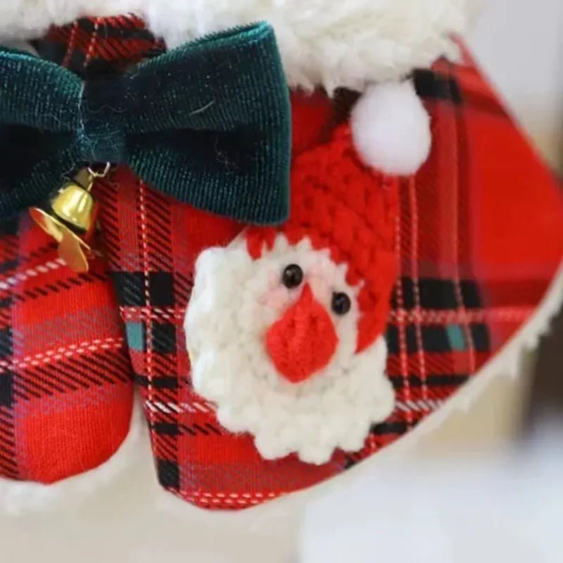 Close-up of a dog wearing a red plaid bandana collar, a cute holiday pet accessory.