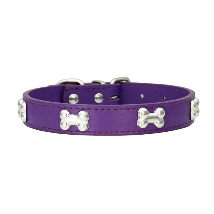 Close-up of the breakaway mechanism on a red safety collar for small dogs.