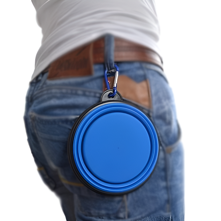 Red collapsible silicone travel pet bowl, potable for dogs & cats, perfect for outdoor adventures.