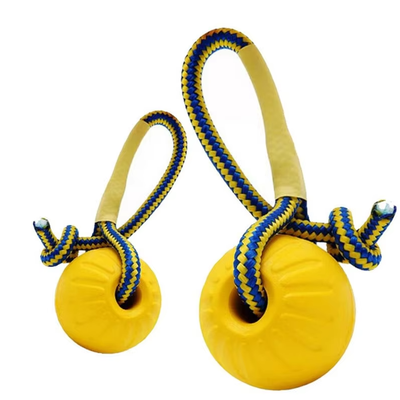 Close-up of robust black dog chew toy ball designed for tough tugging and fetching