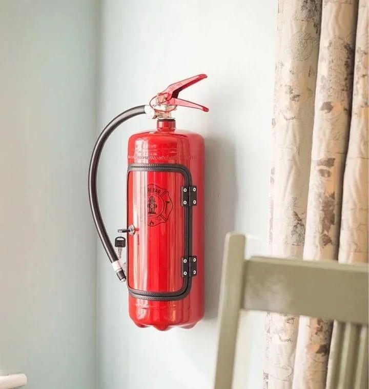 Surprise secret mini bar disguised as a red fire extinguisher. Hidden drink storage for a fun man cave or gift.