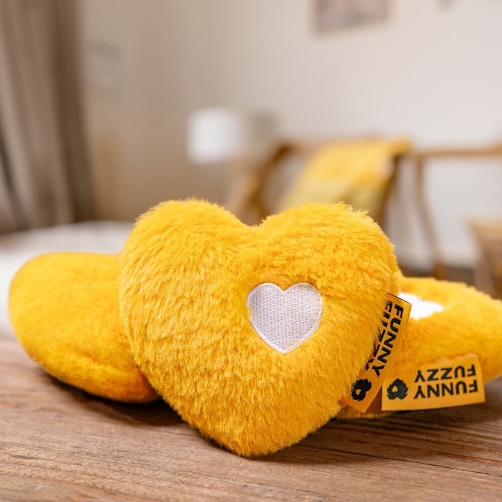 Collection of red heart plush squeaky dog toys, showcasing their soft texture and vibrant color for pets.