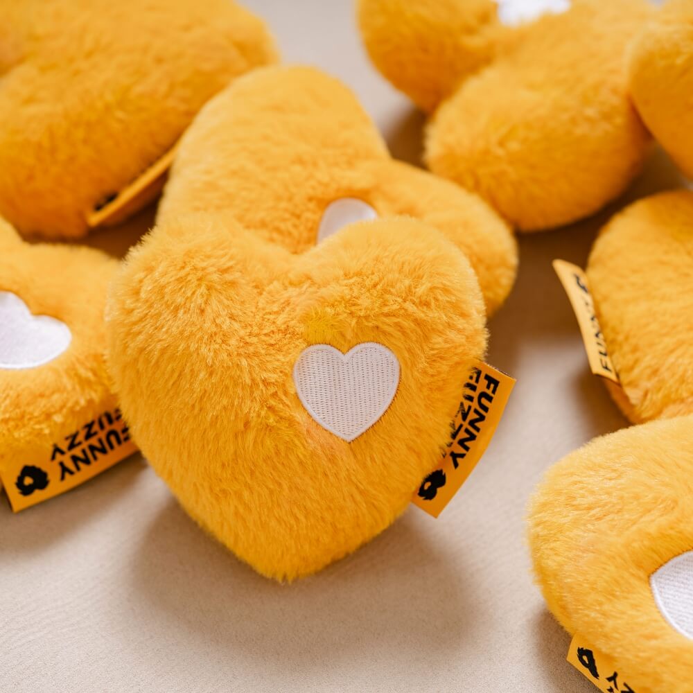 Interactive heart comfort toy for pets, featuring a squeaker inside, great for chewing and cuddling.