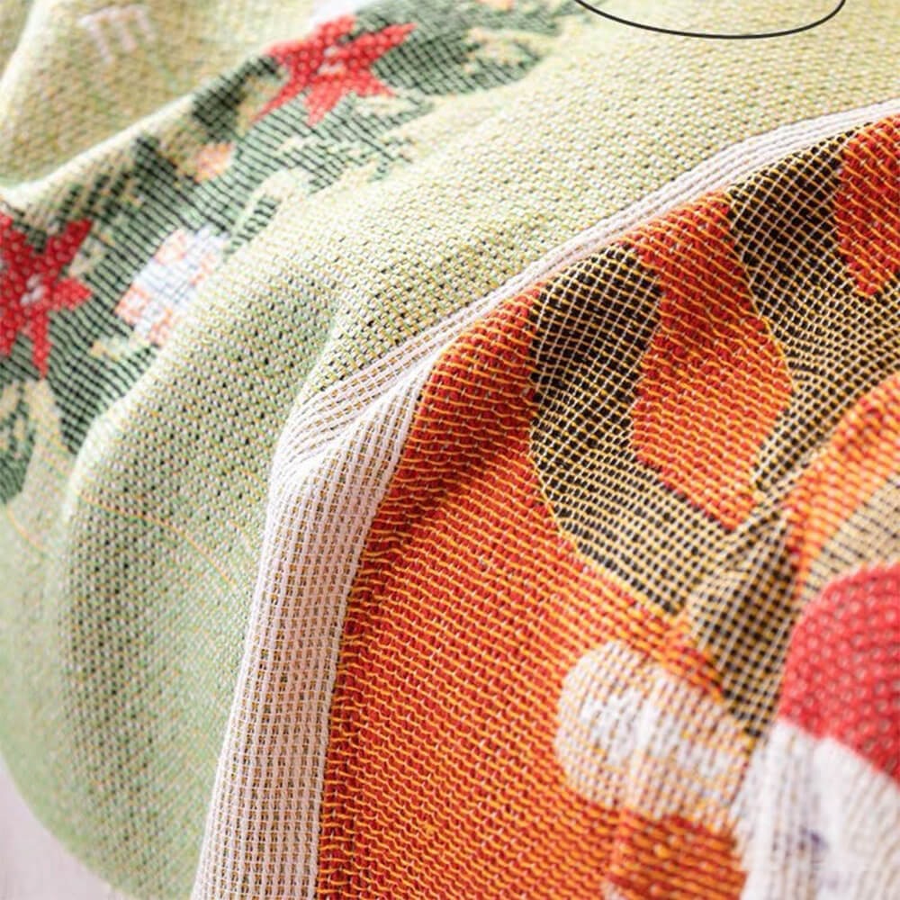 Full view of a couch protected by a new Jacquard knit Christmas sofa cover