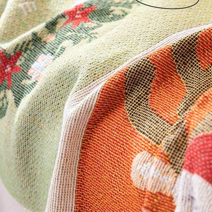 Full view of a couch protected by a new Jacquard knit Christmas sofa cover