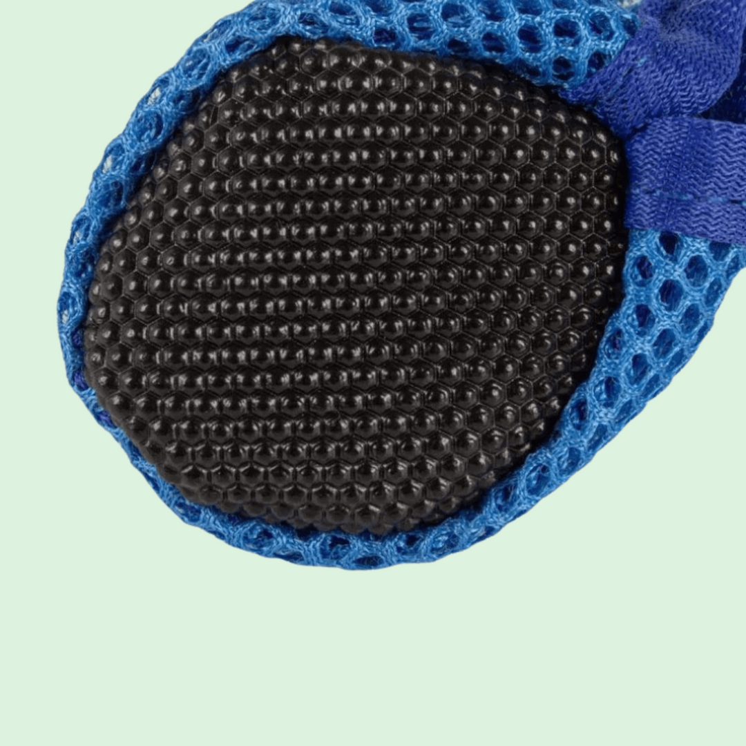 Set of 4 durable dog shoes in various colors, ideal for paw protection for small and medium dog breeds.