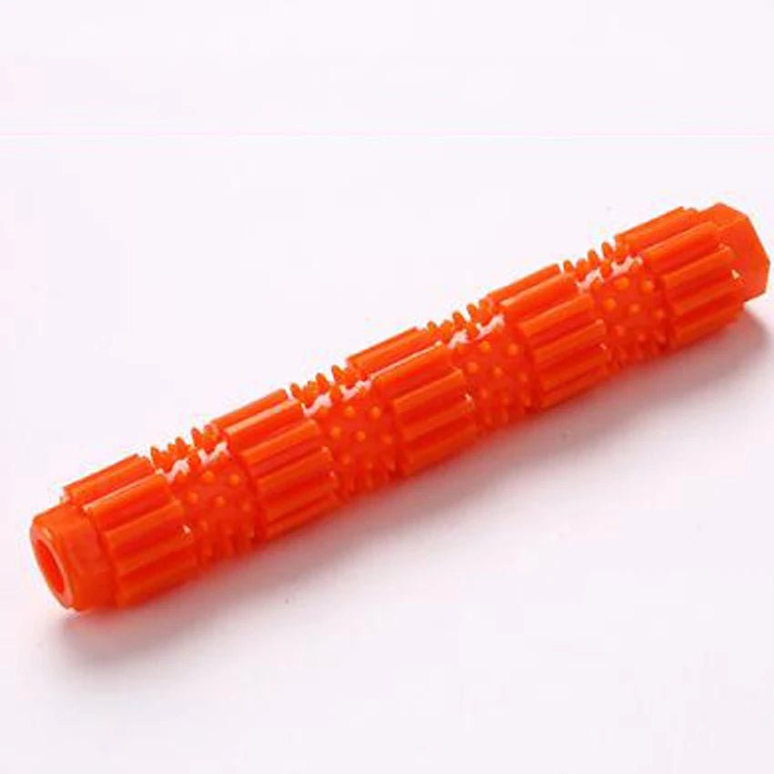 Red rubber indestructible dog chew toy for aggressive chewers, textured surface