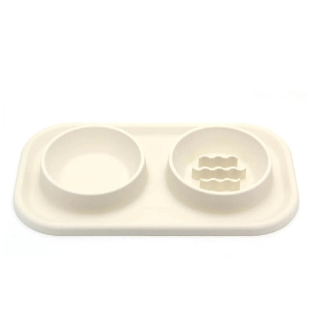 Red silicone pet slow feeder dual bowl for dogs and cats, promoting healthy eating habits