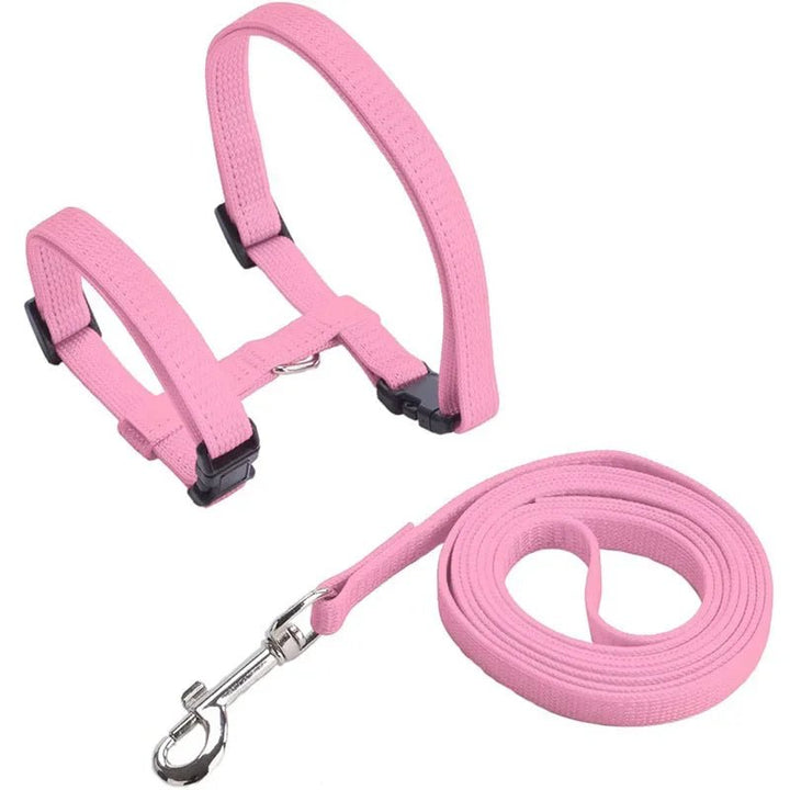 Pink H-shape adjustable pet harness with anti-escape features for small puppies.