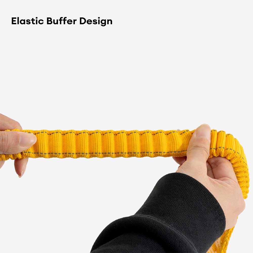 Close-up of the reflective strip on an elastic nylon dog leash, enhanced visibility for evening walks.
