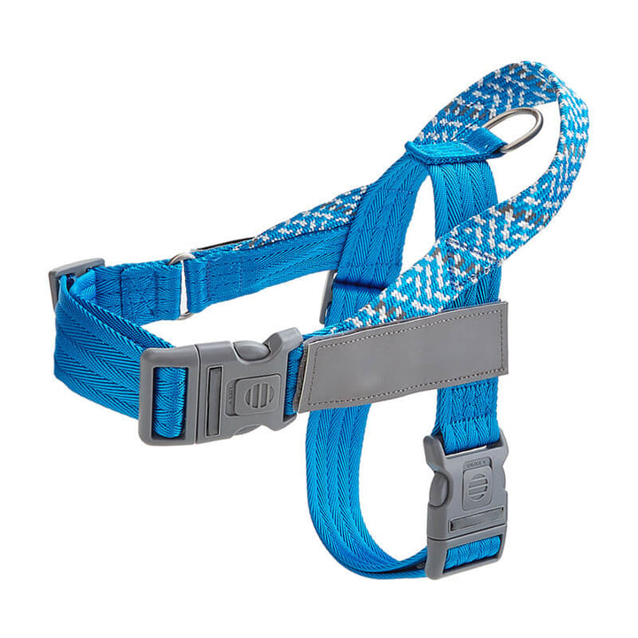 Black reflective anti-pull dog harness worn by a medium-sized dog, showing secure fit and comfort