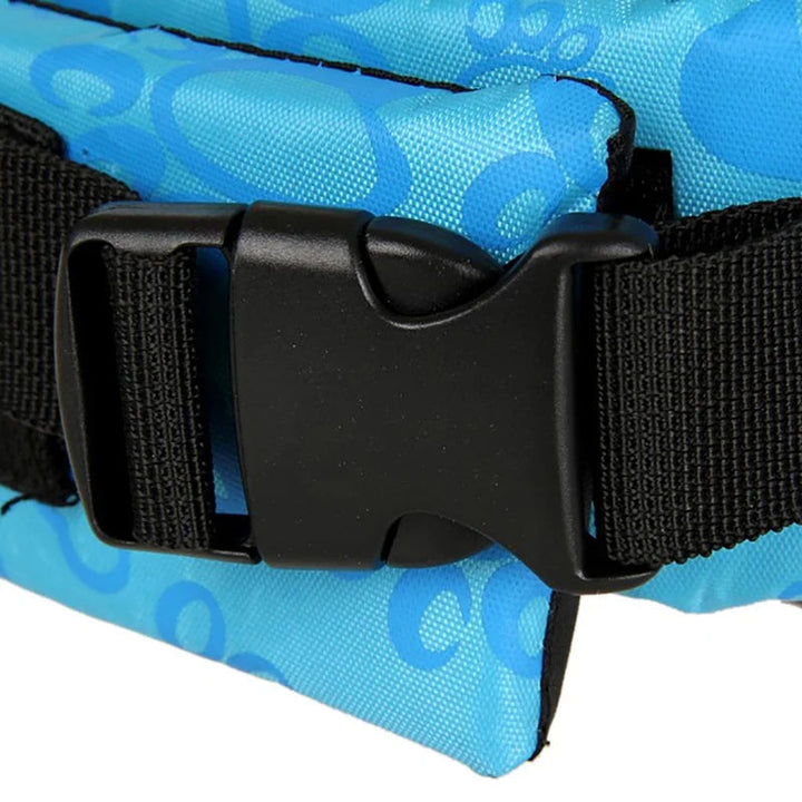 Top-down view of a dog flotation vest with a durable handle for easy retrieval during water sports.