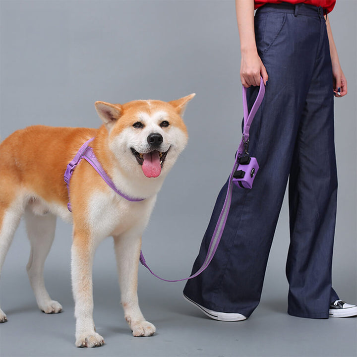 Adjustable nylon dog vest harness in black, featuring reflective strips for night safety.