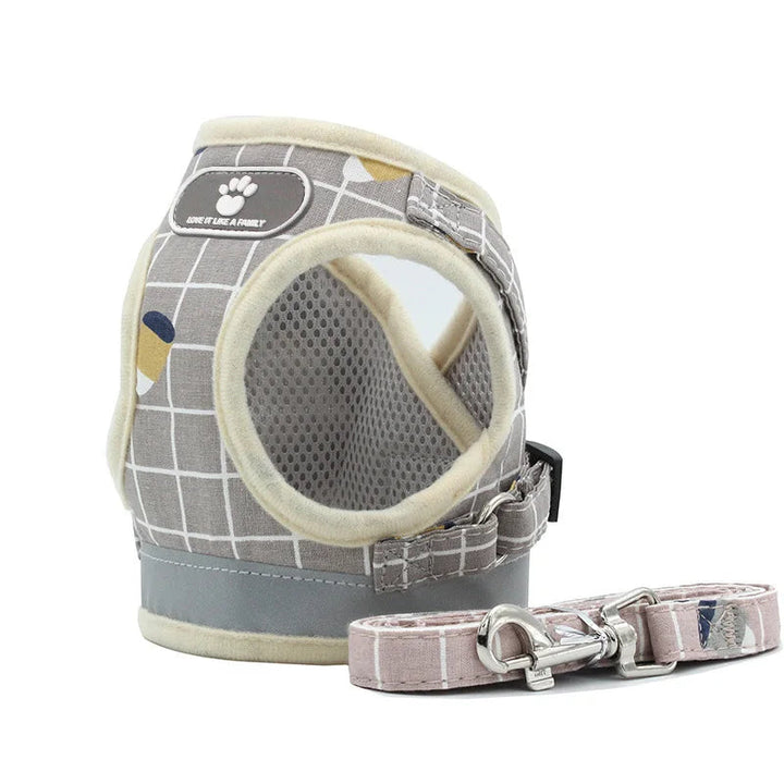 Reflective pet vest in vibrant pink, breathable and adjustable with a matching leash for safe and comfortable dog walks.