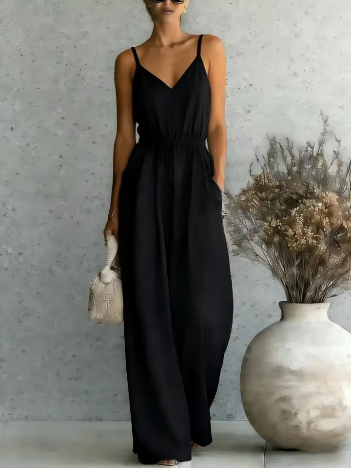 Stylish women's wide leg jumpsuit with V-neck and sleeveless design for relaxed, casual summer fashion.