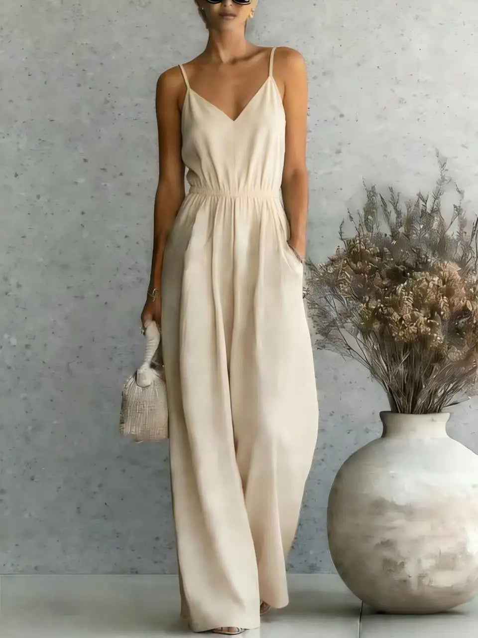 Effortless V-neck wide leg jumpsuit for women. A comfortable, sleeveless, relaxed fit perfect for vacations.