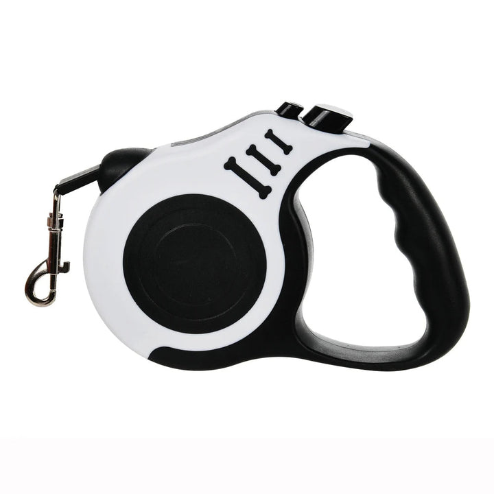 Dog owner holding a retractable pet leash, showcasing its ergonomic handle and design