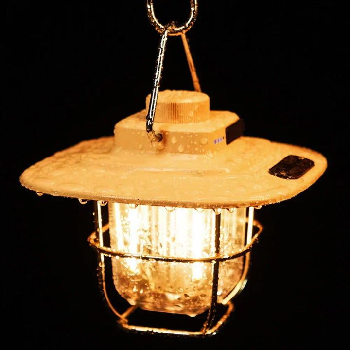 Compact rechargeable LED camping lantern, retro design, essential portable light for outdoor gear & emergencies.