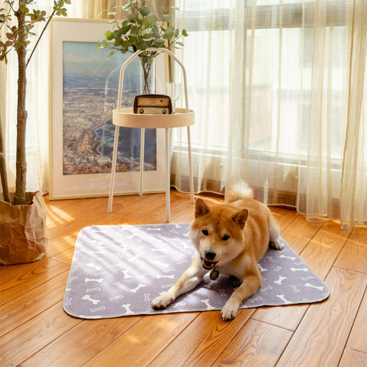 Reusable absorbent training pad for effective puppy training and senior pet care, gray fabric.