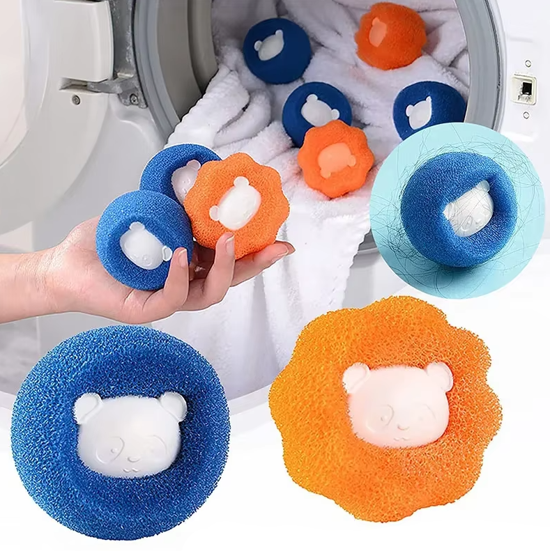 Reusable dryer balls removing pet hair and lint from dark laundry in a dryer drum.