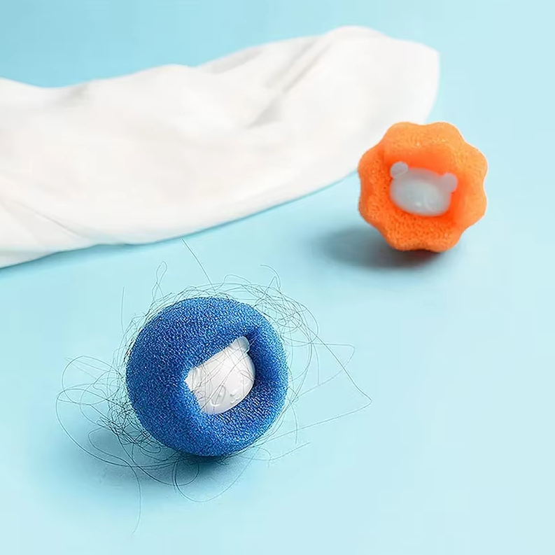 Two dryer balls shown with collected pet fur, demonstrating their lint catcher functionality.
