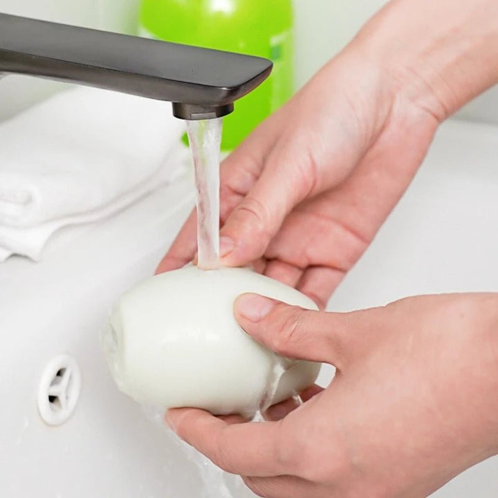 Compact lint roller, perfect for travel, removes lint and fuzz from clothing.