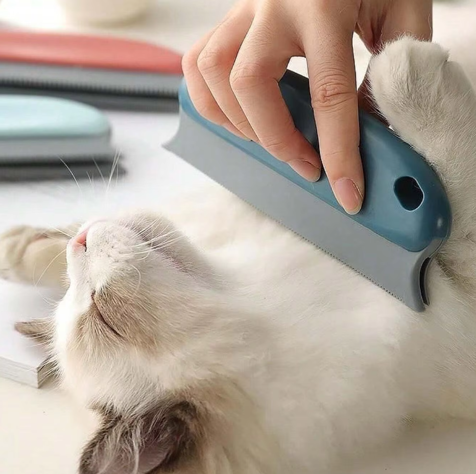 Handheld reusable pet hair remover with ergonomic grip being used to clean lint from a black jacket.