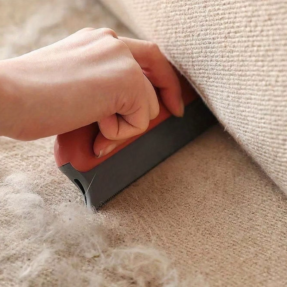 Close-up of the double-sided fabric surface of a reusable pet hair remover, ready for fur collection.
