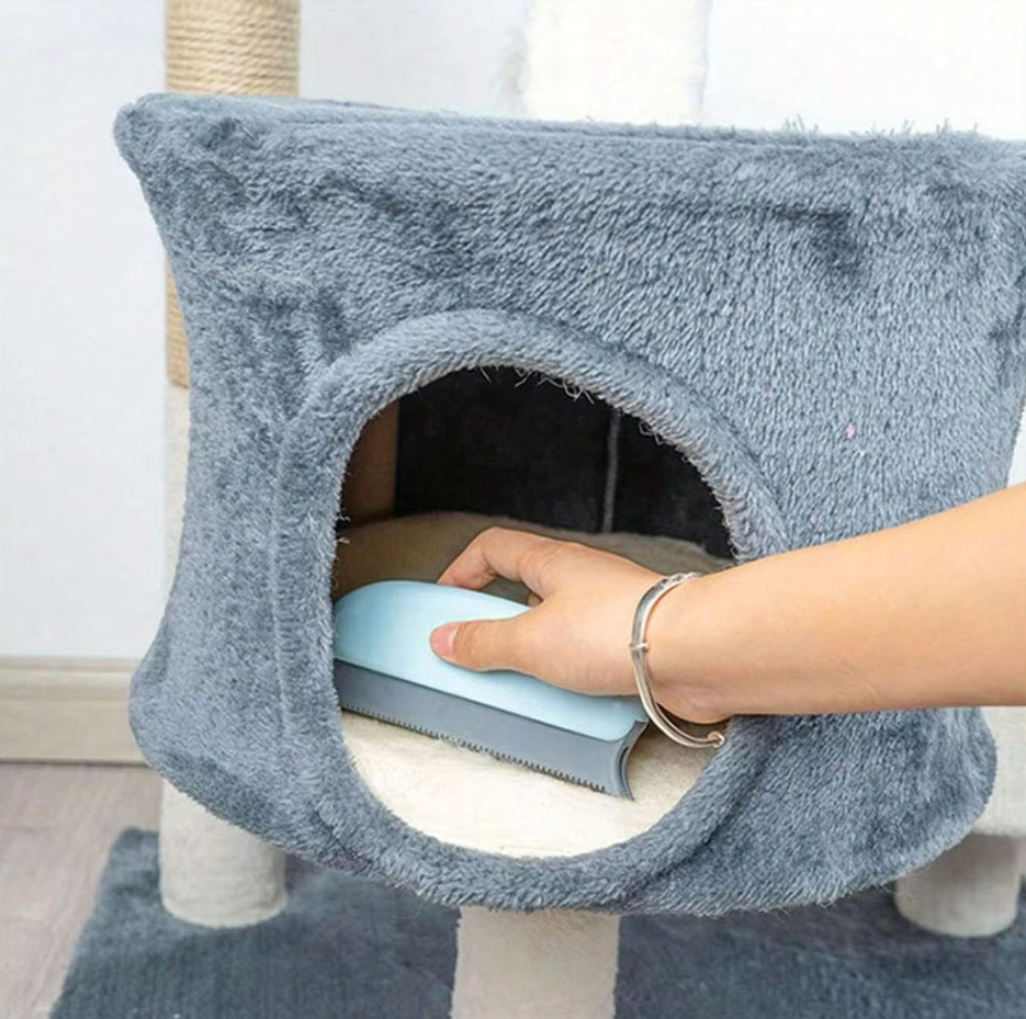 Bundle of two reusable pet hair removers next to a cat on a carpet, emphasizing home cleaning convenience.